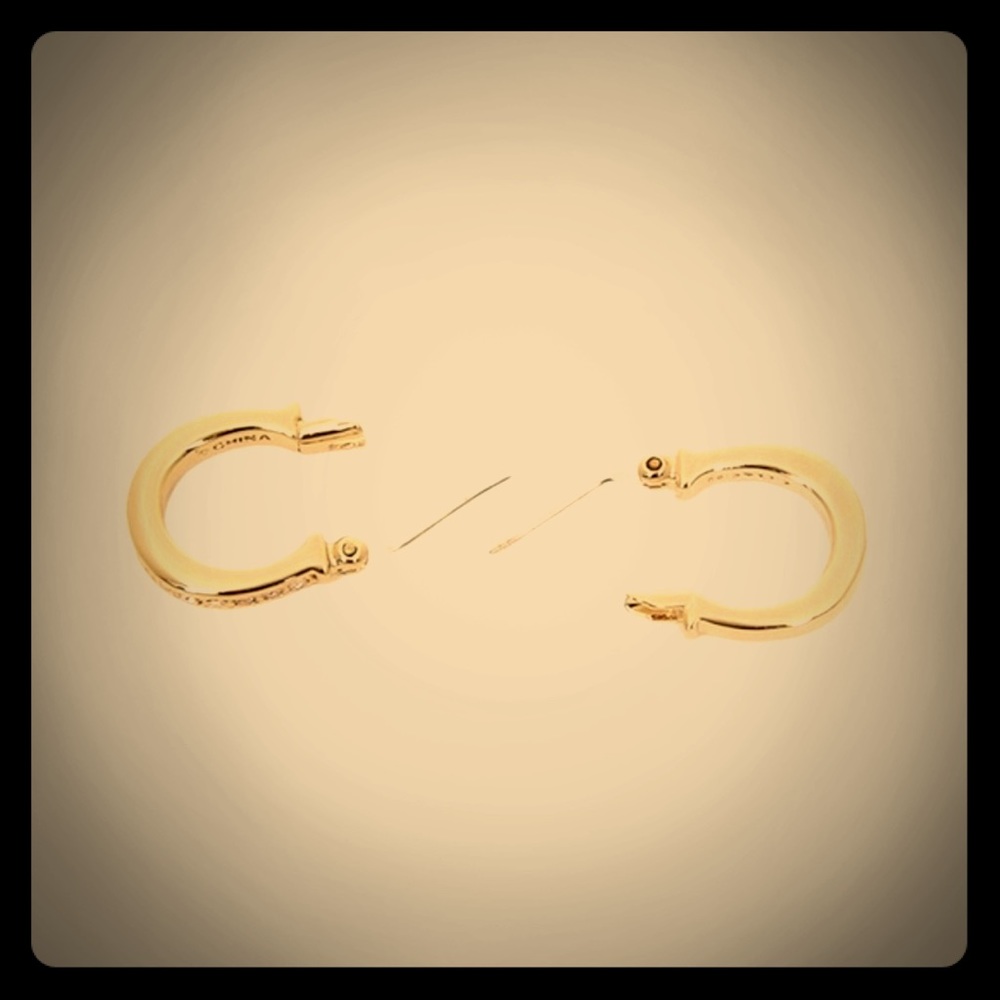 Coach gold & pave crystals earrings. F54497